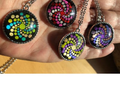 Glass pendants with mandala designs.