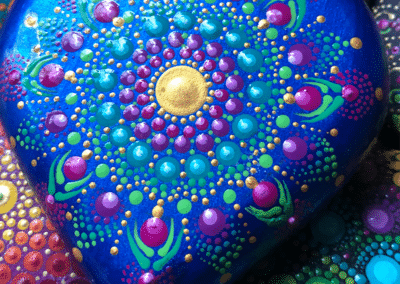 Hand-cast heart with mandala design in bright colors.