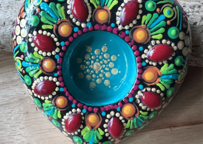 Heart shaped, hand-cast tea light holder. Bright colors used for this mandala design.