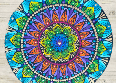 Multi-colored mandala design on 8" wood board.