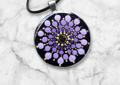 Mandala design on metal tray, finished with resin and cord.
